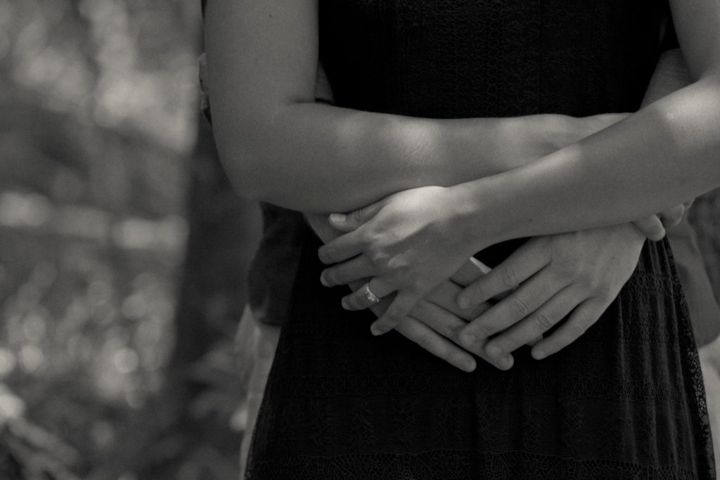 black and white hug