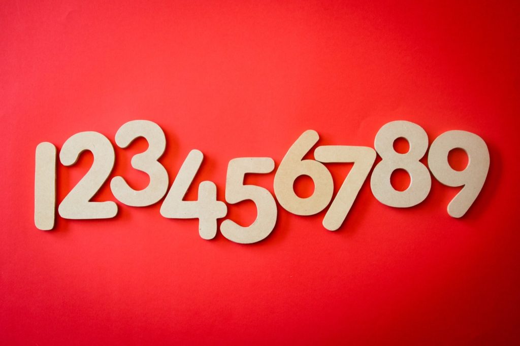The numbers one through nine on a red background