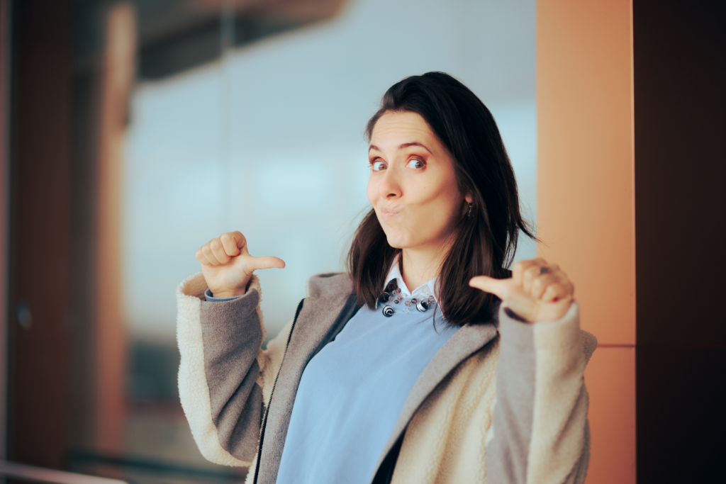 Woman pointing to herself