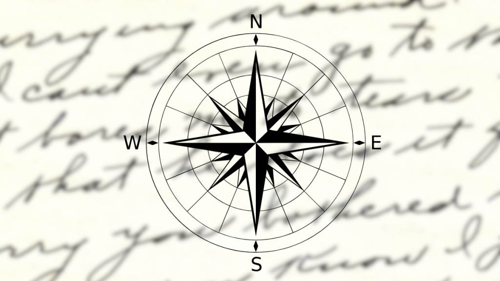 A compass on a background of handwritten words